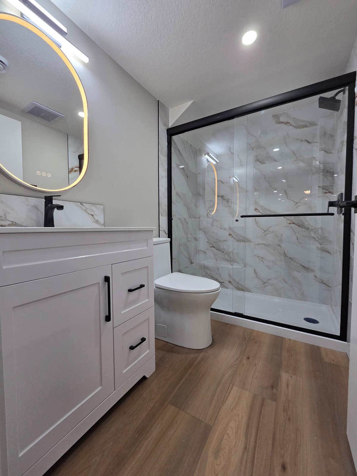 Finished suite bathroom with glass shower