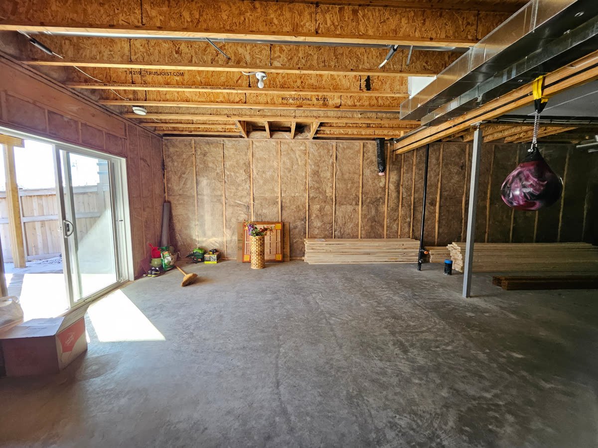 Unfinished framed basement before development